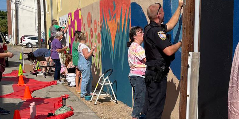 Paragould Police Dept. stopping by and helping out painting.