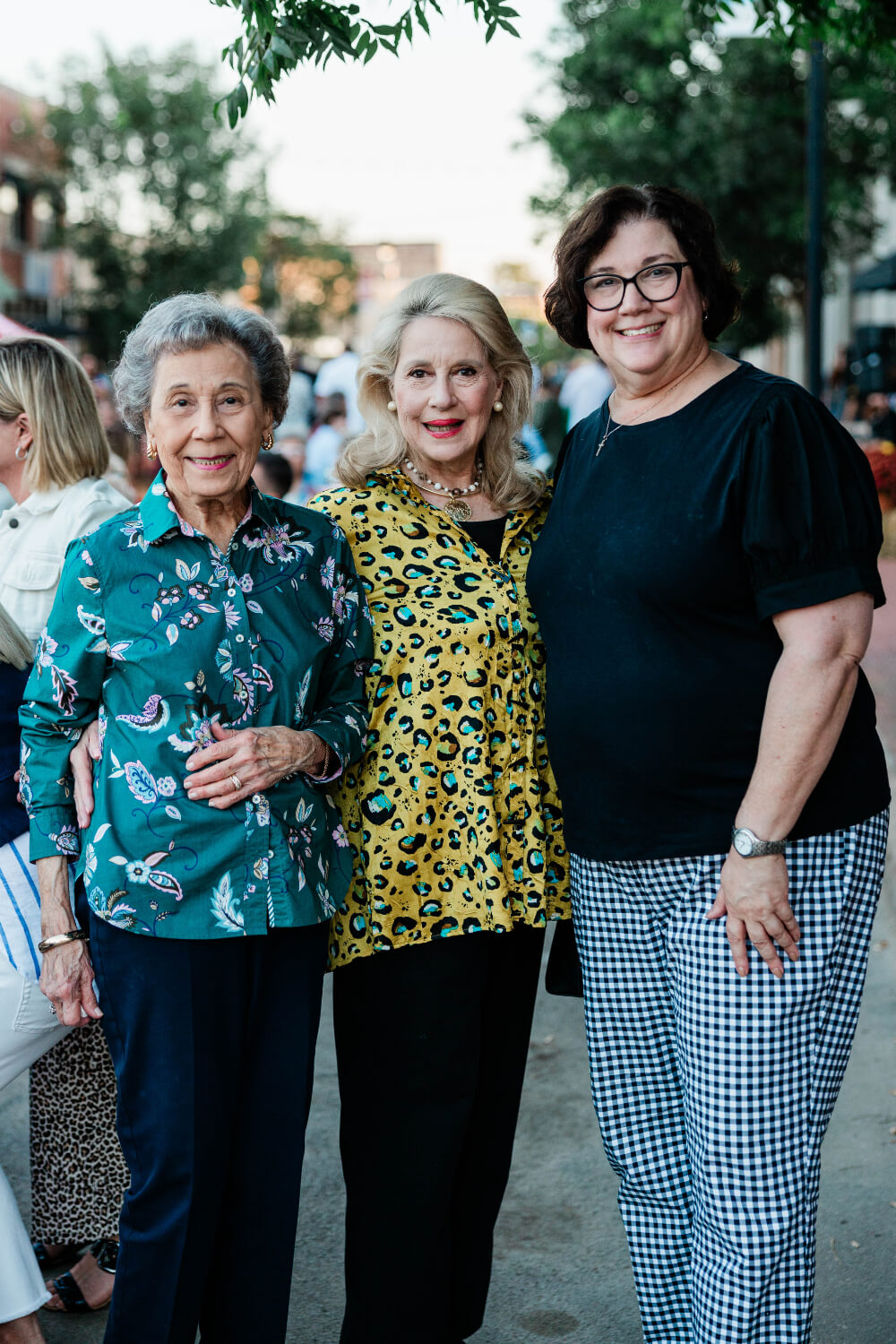 Three women posing together at Plates on Pruett.