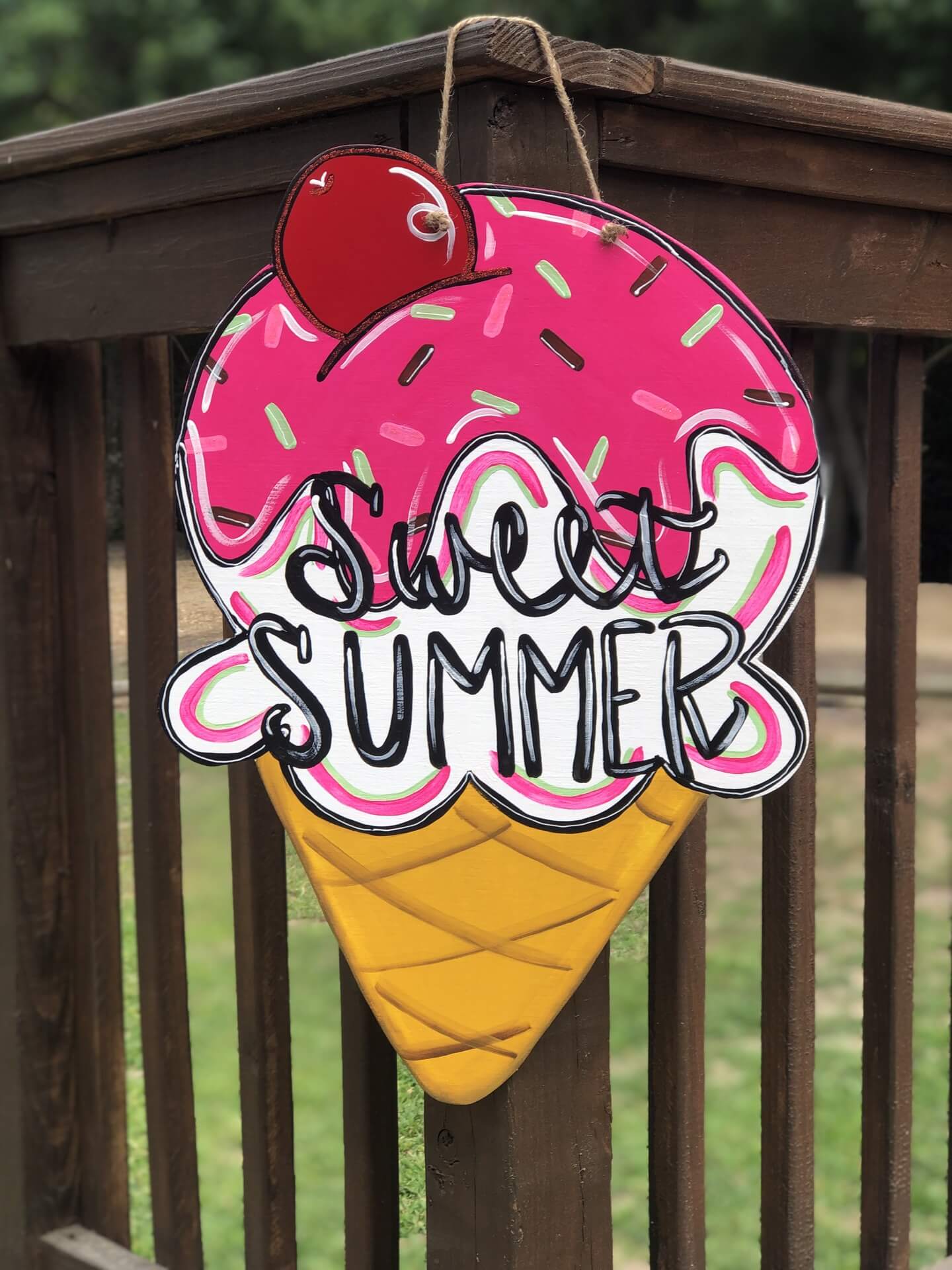 Ice Cream Cone painted and says Sweet Summer on it. The ice cream is pink with sprinkles