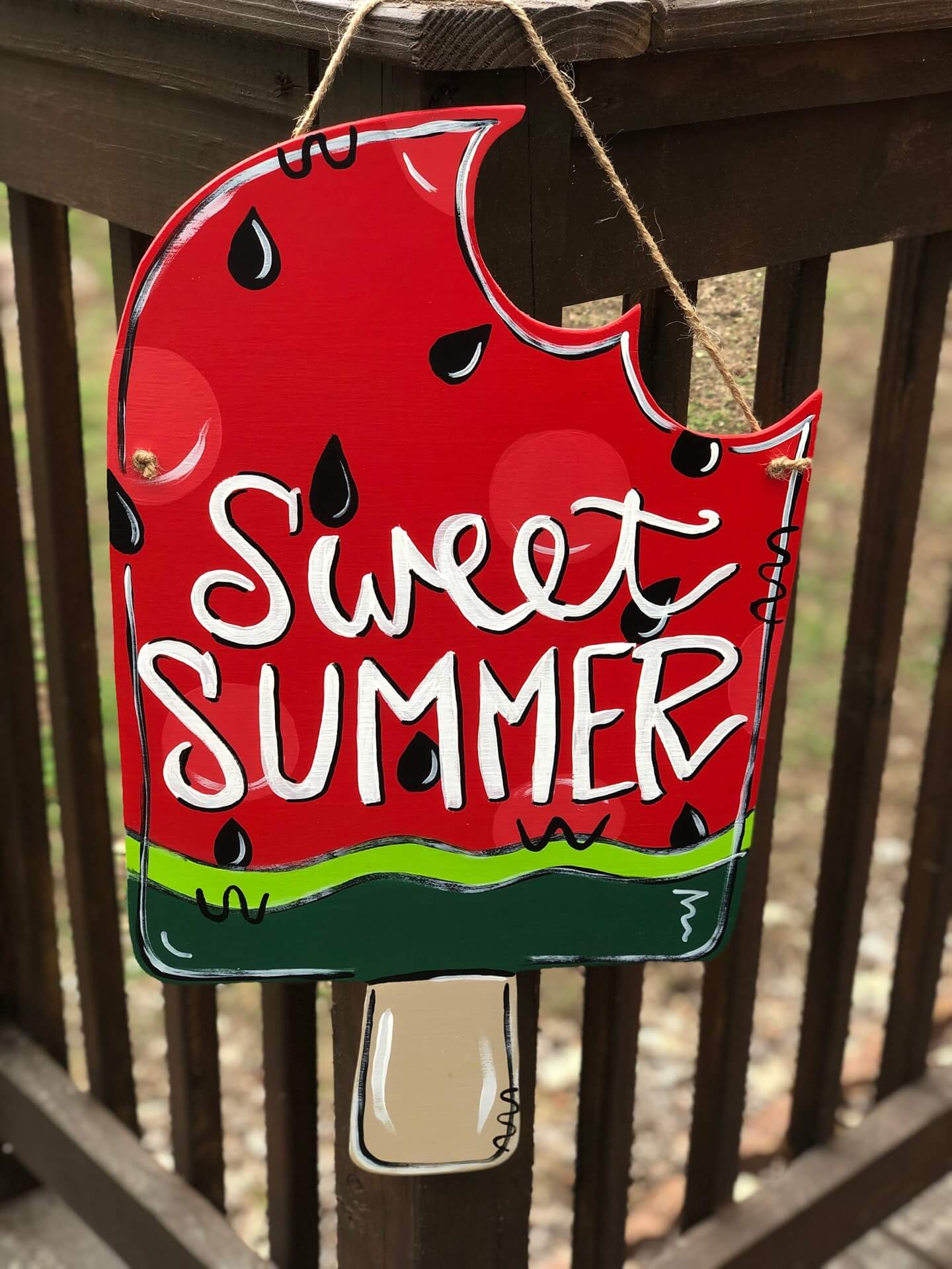 Popsicle painted like a watermelon with Sweet Summer painted on it