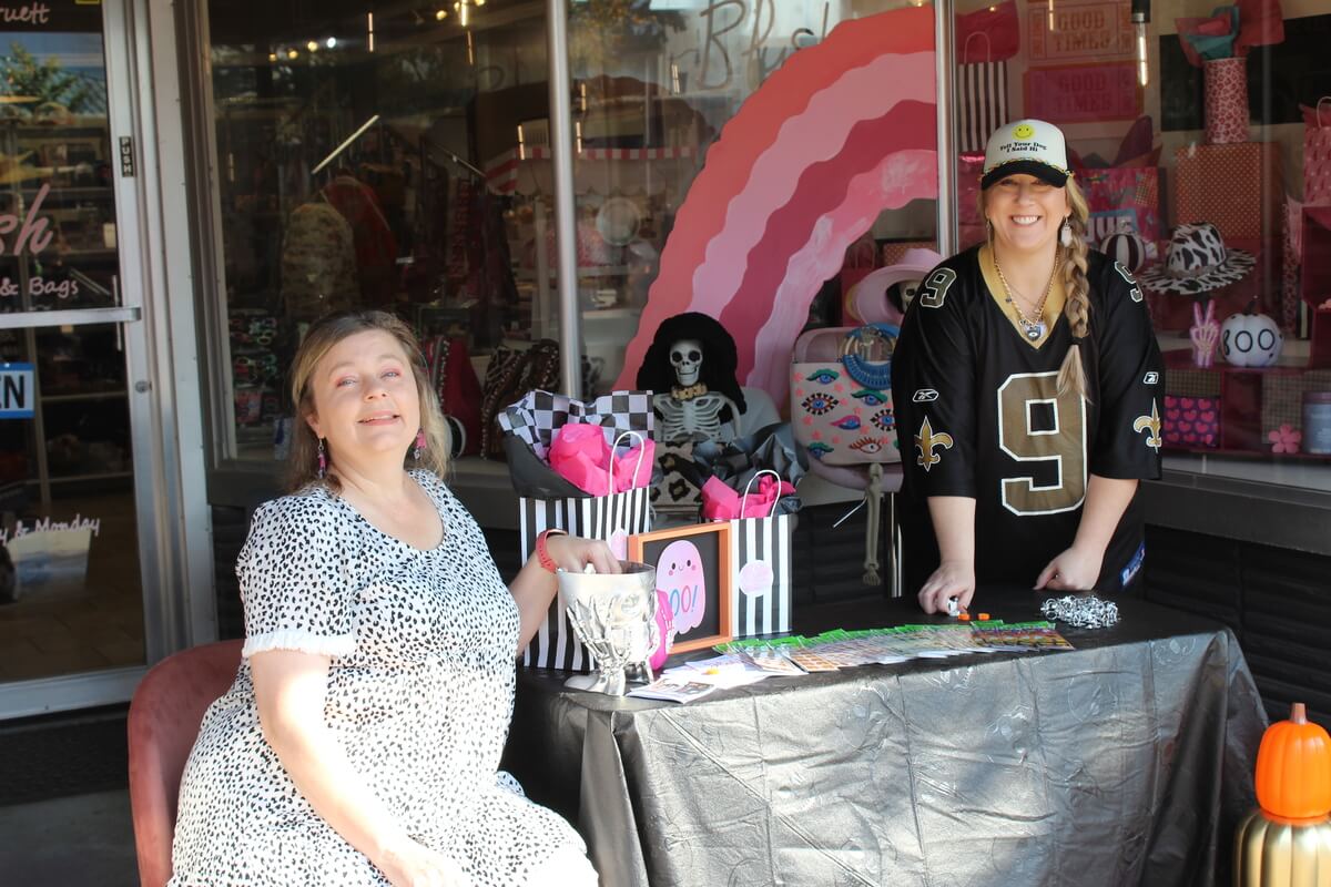 Giving Candy to Trick or Treaters along Downtown