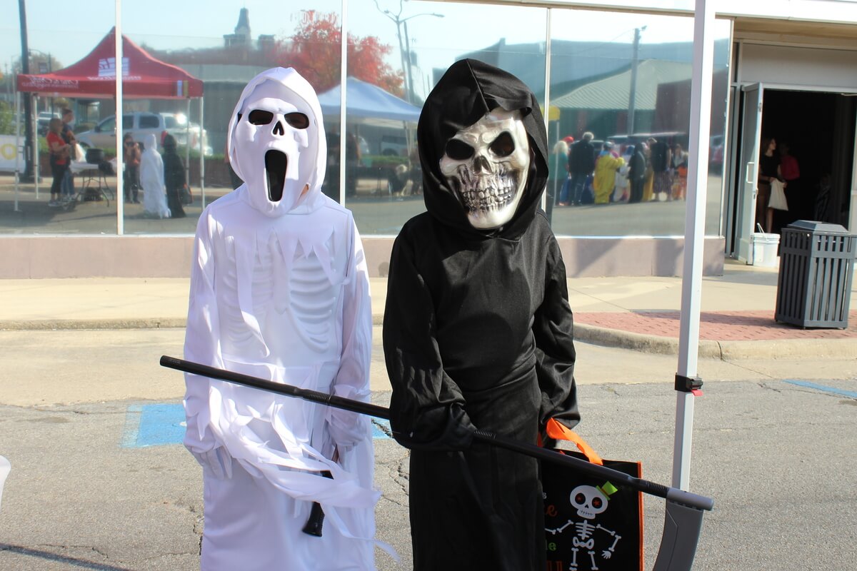 Scary looking children Trick or Treaters along Downtown