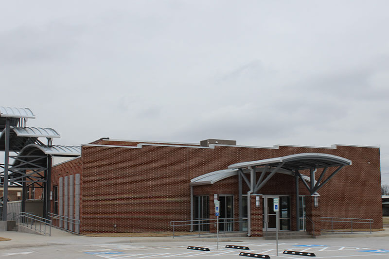 Exterior of The Station with parking view.