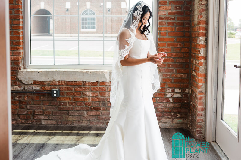 Bride looking at her ring inside The Station